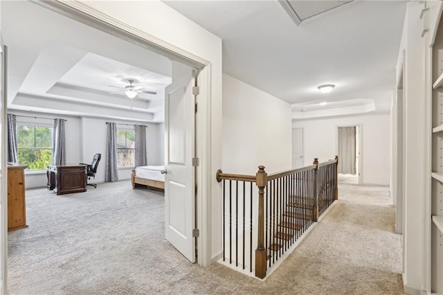 4459 Sierra Creek Dr, Hoschton, GA 30548 - hallway with carpet flooring, an upstairs landing, and a raised ceiling