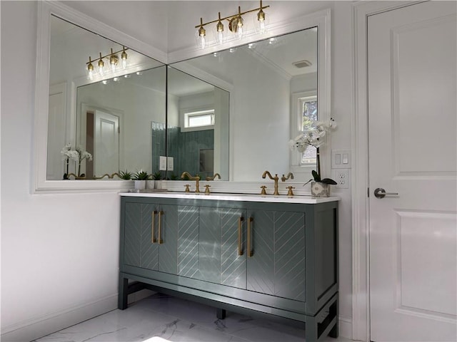 bathroom featuring crown molding and vanity