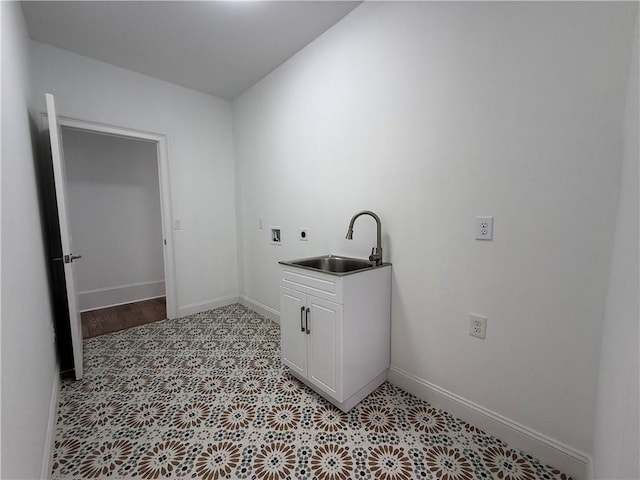 clothes washing area with hookup for a washing machine, sink, and hookup for an electric dryer