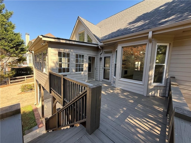 rear view of house featuring central AC unit, a garage, a yard, and a patio