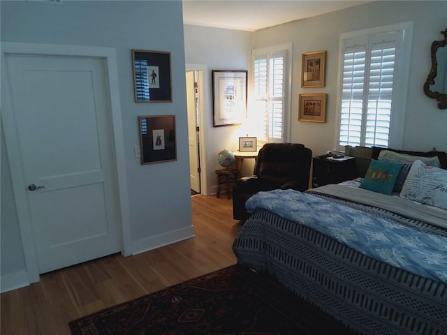 3655 Peachtree Rd Unit 203, Atlanta, GA 30319 - bedroom featuring wood finished floors and multiple windows