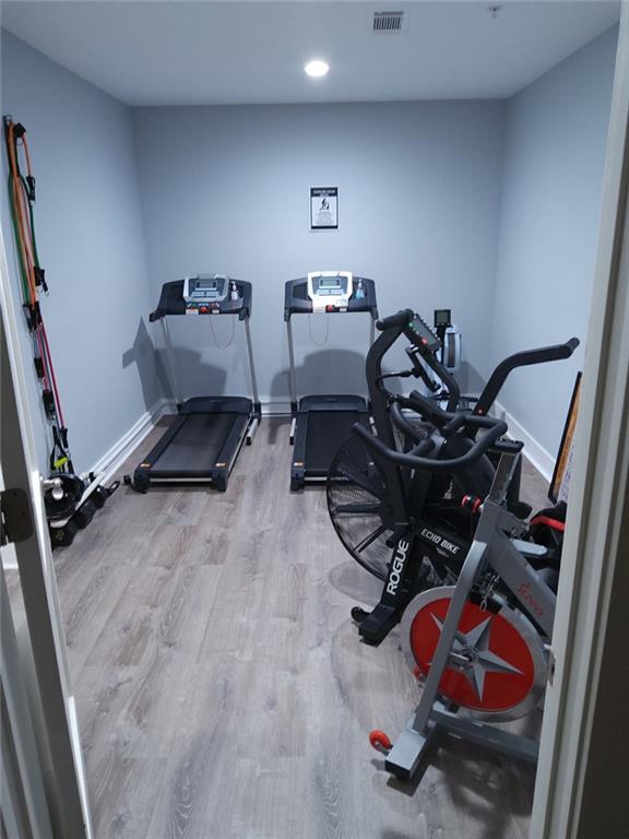3655 Peachtree Rd Unit 203, Atlanta, GA 30319 - exercise room featuring wood finished floors and recessed lighting