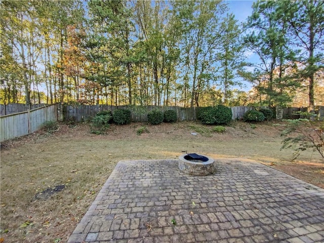 view of yard with an outdoor fire pit