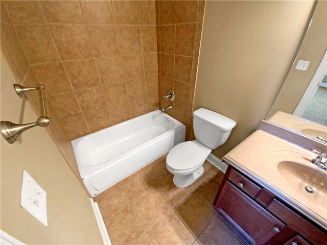 full bathroom featuring tile patterned floors, vanity, toilet, and tiled shower / bath combo