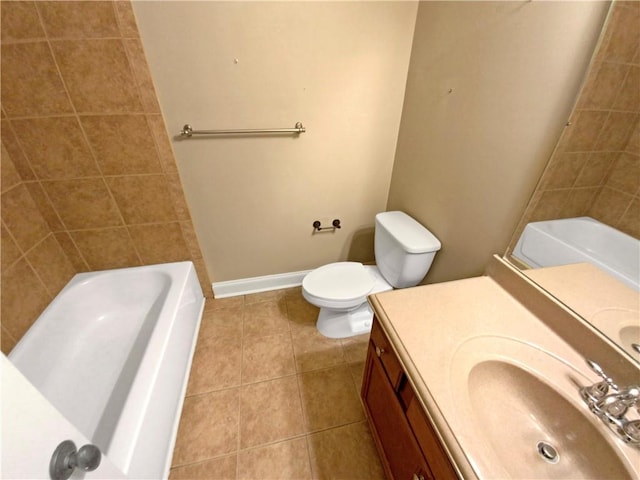 bathroom with tile patterned flooring, vanity, and toilet