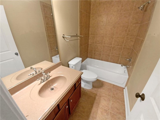 full bathroom featuring tile patterned floors, vanity, toilet, and tiled shower / bath combo