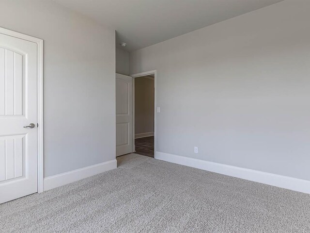 76 Lakeview Pt, Dallas, GA 30157 - spare room featuring carpet floors, visible vents, and baseboards
