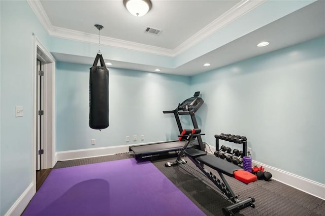 workout area featuring ornamental molding, recessed lighting, visible vents, and baseboards