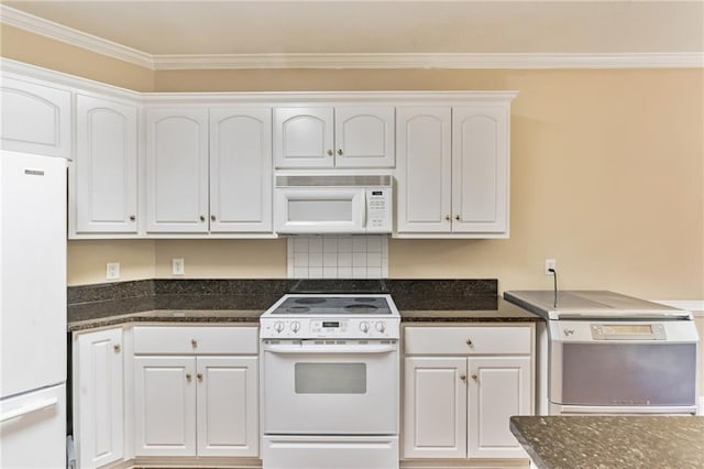 656 Deerwood Way, Evans, GA 30809 - kitchen featuring white appliances, white cabinetry, ornamental molding, and dark stone counters