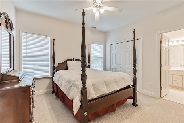 656 Deerwood Way, Evans, GA 30809 - bedroom with baseboards, light colored carpet, a closet, a ceiling fan, and ensuite bath