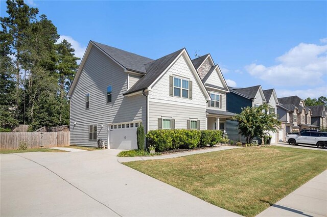 view of front facade with a front yard and a garage