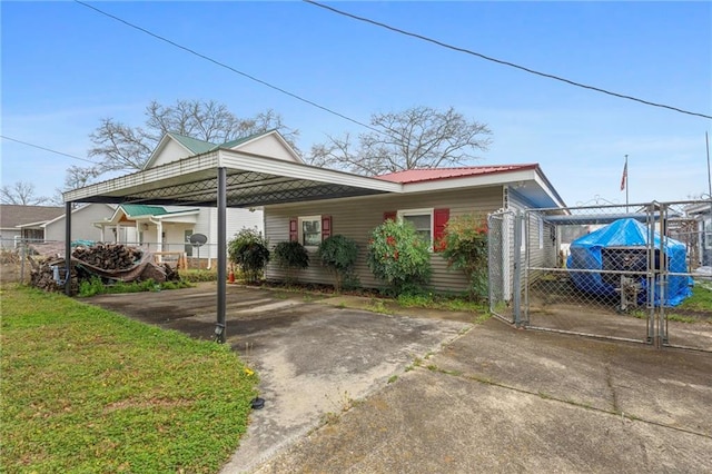 view of vehicle parking with a carport