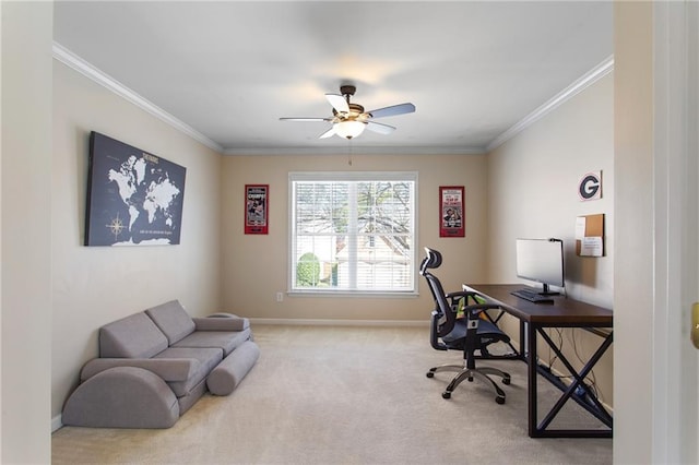 office space featuring baseboards, a ceiling fan, crown molding, and carpet