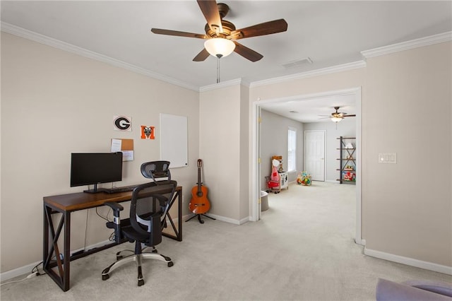 office with visible vents, baseboards, light colored carpet, ornamental molding, and a ceiling fan