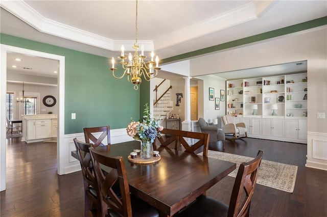 dining room with dark wood finished floors, stairway, wainscoting, a notable chandelier, and a raised ceiling