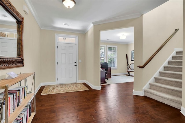 foyer featuring dark hardwood / wood-style flooring and ornamental molding