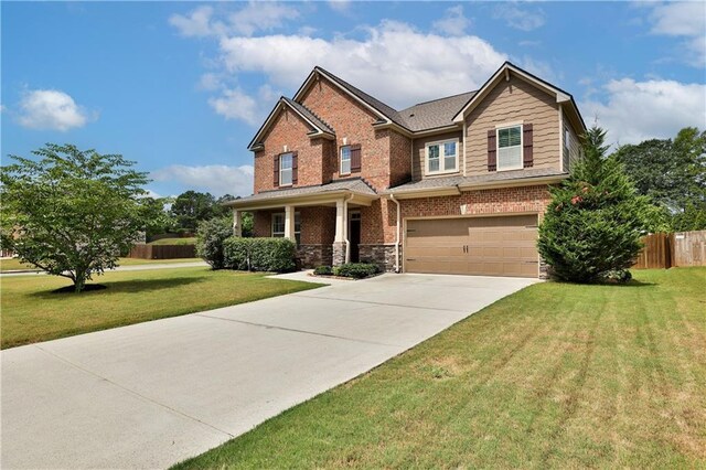 craftsman-style home with a garage and a front yard