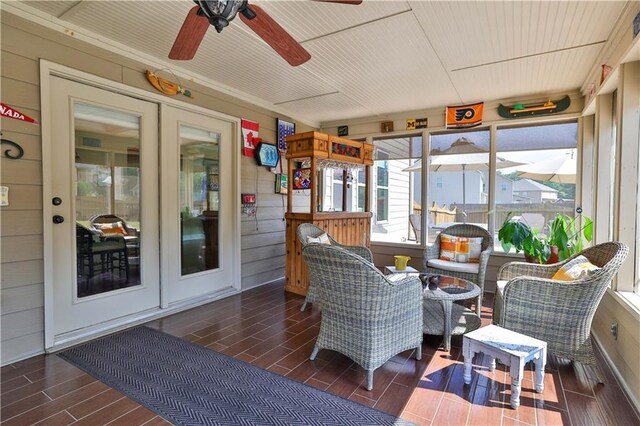 sunroom / solarium with ceiling fan