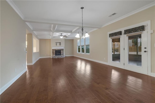 unfurnished living room with ornamental molding, coffered ceiling, ceiling fan with notable chandelier, dark wood-type flooring, and beam ceiling