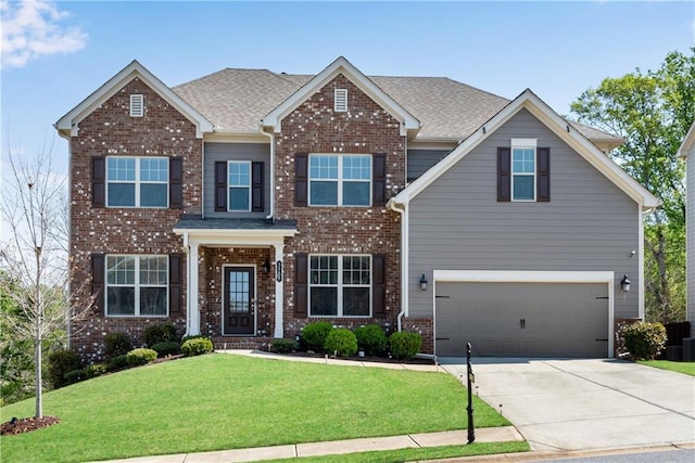 3950 Grandview Manor Dr, Cumming, GA 30028 - craftsman house with a front lawn, driveway, brick siding, a garage, and a shingled roof