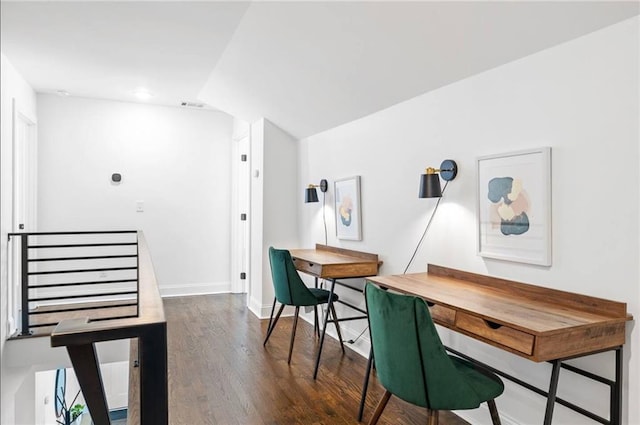 office space featuring lofted ceiling and dark hardwood / wood-style flooring