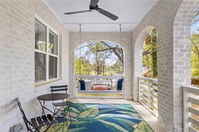 view of patio featuring ceiling fan