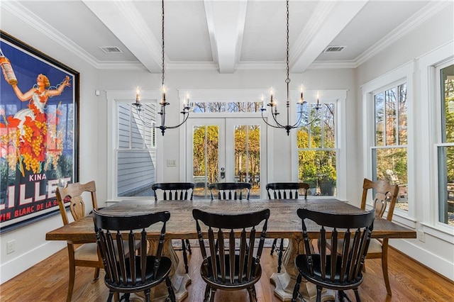 dining area featuring visible vents, beamed ceiling, wood finished floors, and a chandelier