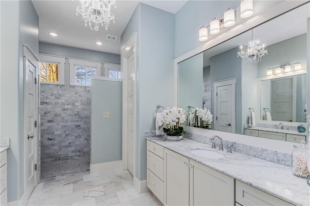 bathroom featuring vanity, visible vents, marble finish floor, walk in shower, and a chandelier
