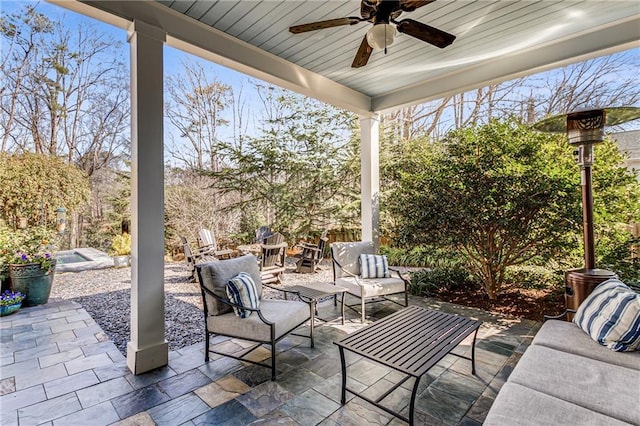 view of patio with outdoor lounge area and a ceiling fan