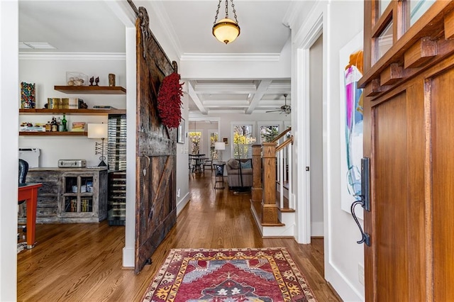 entrance foyer with ornamental molding, wood finished floors, beamed ceiling, baseboards, and coffered ceiling
