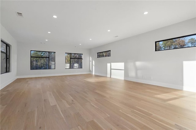 unfurnished living room featuring light wood-type flooring