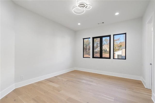 unfurnished room with light hardwood / wood-style flooring