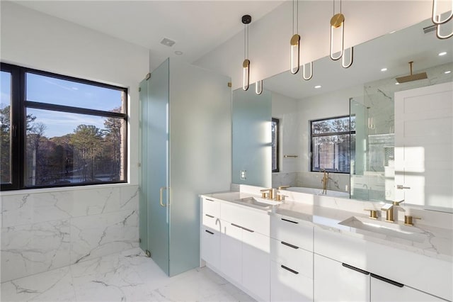 bathroom with vanity and a shower with shower door