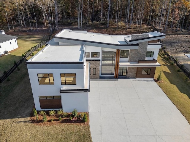 contemporary house with a front lawn