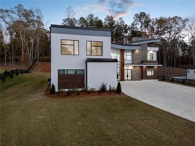 contemporary home featuring a lawn