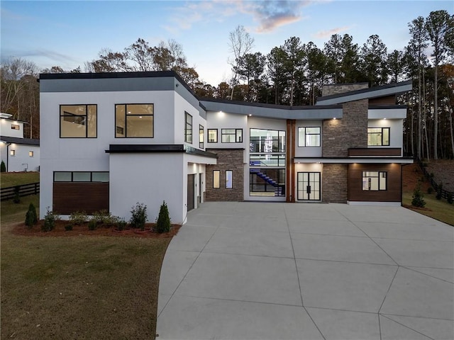 contemporary home featuring a yard