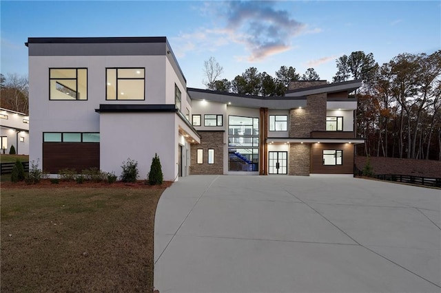 contemporary house with a lawn