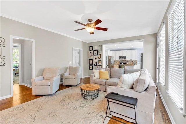 3921 Upland Way, Marietta, GA 30066 - living room featuring wood finished floors, crown molding, baseboards, and ceiling fan