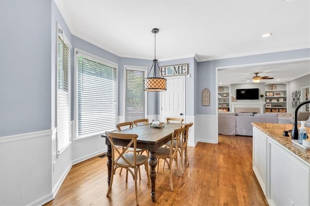 3921 Upland Way, Marietta, GA 30066 - dining area with wainscoting, a wealth of natural light, and light wood-type flooring
