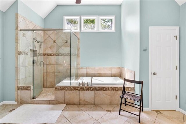 3921 Upland Way, Marietta, GA 30066 - full bathroom featuring tile patterned floors, vaulted ceiling, baseboards, a shower stall, and a garden tub