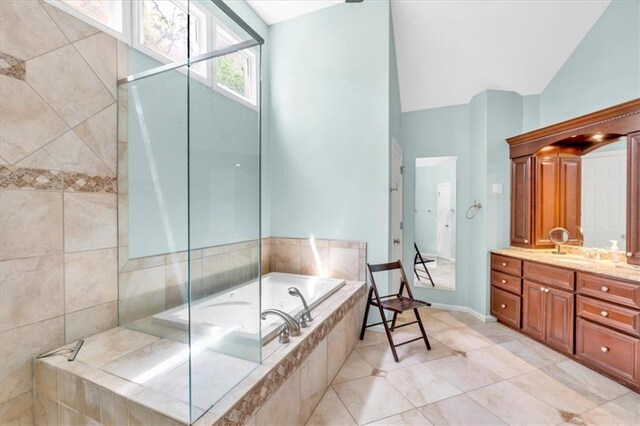 3921 Upland Way, Marietta, GA 30066 - bathroom featuring a bath, tile patterned floors, vaulted ceiling, and vanity