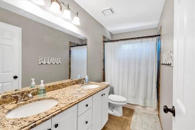3921 Upland Way, Marietta, GA 30066 - full bathroom featuring tile patterned flooring, a sink, double vanity, and toilet