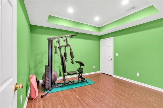 3921 Upland Way, Marietta, GA 30066 - workout room with wood finished floors, a tray ceiling, baseboards, visible vents, and recessed lighting