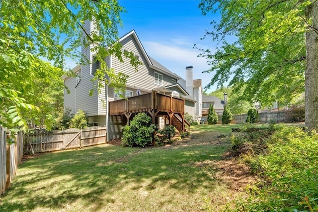 3921 Upland Way, Marietta, GA 30066 - rear view of property with stairway, a wooden deck, a fenced backyard, and a lawn