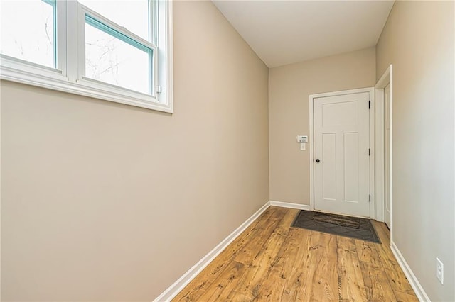 entryway with light hardwood / wood-style floors