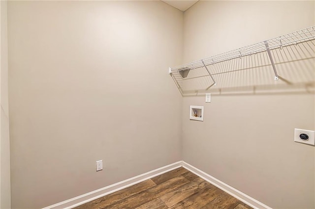 clothes washing area featuring hookup for an electric dryer, dark wood-type flooring, and hookup for a washing machine