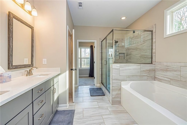 bathroom featuring separate shower and tub, tile patterned floors, and vanity