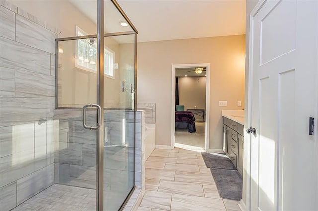 bathroom featuring vanity and a shower with shower door