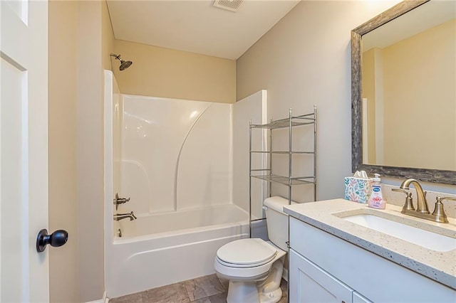 full bathroom featuring toilet, vanity, and tub / shower combination