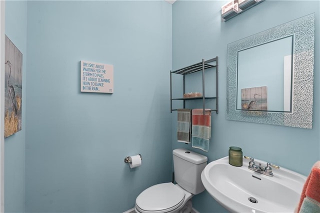 859 Scales Rd, Suwanee, GA 30024 - half bath featuring a sink, toilet, and baseboards